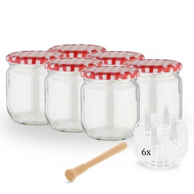 Zwei durchsichtige Glasflaschen mit weißem Etikett und goldfarbenem Schraubverschluss stehen nebeneinander auf weißem Hintergrund; die linke Flasche zeigt die Vorderseite mit der Produktbezeichnung „Vitamalz“, die rechte Flasche ist leicht gedreht und zei